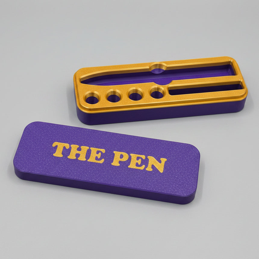 Blue and gold KwikPen case with 'THE PEN' engraving in a gold on blue background